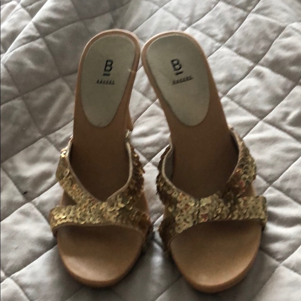 Gold strapped high heel shoes